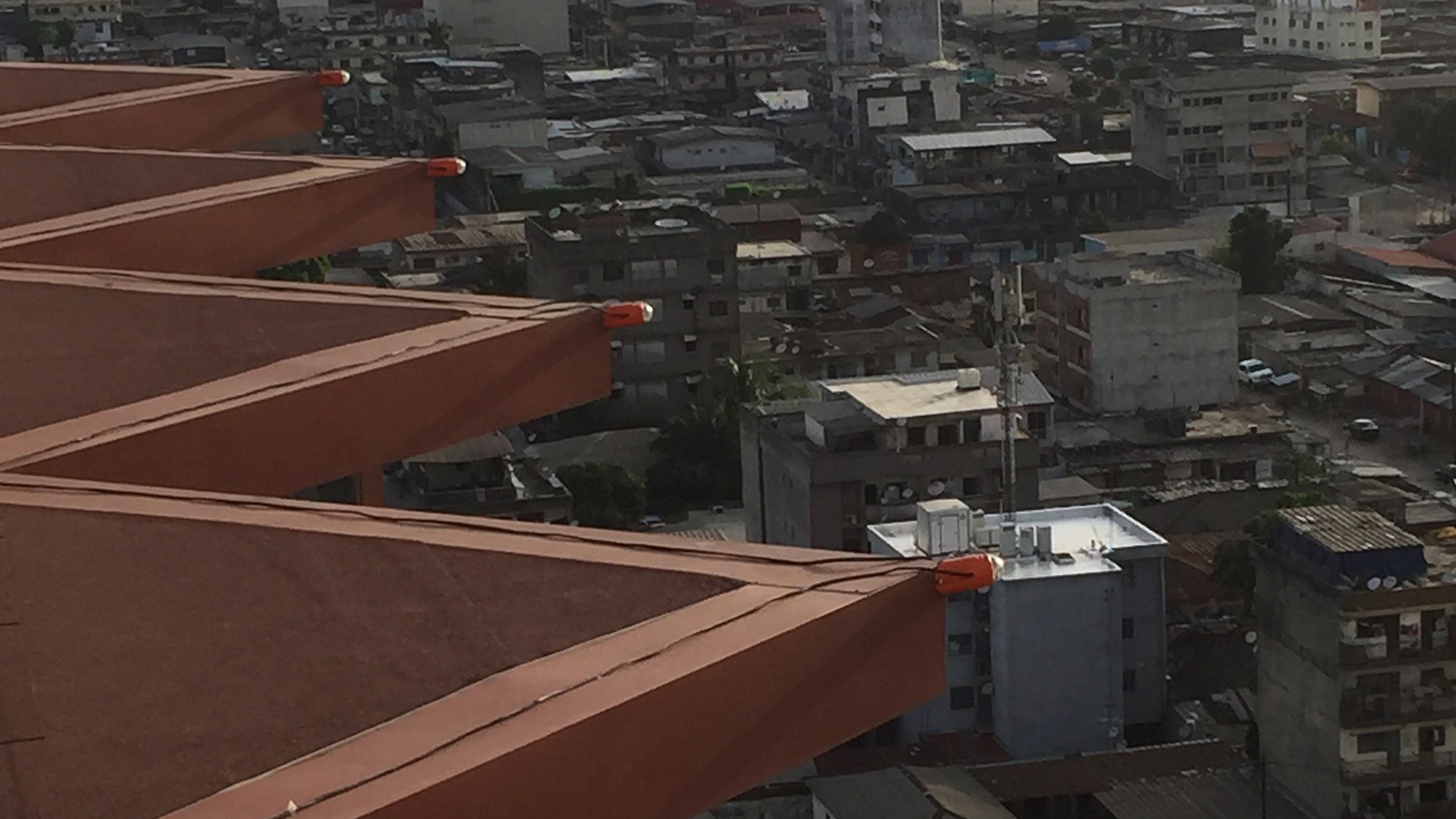 Fixtures positioned along the structural lines of the facade