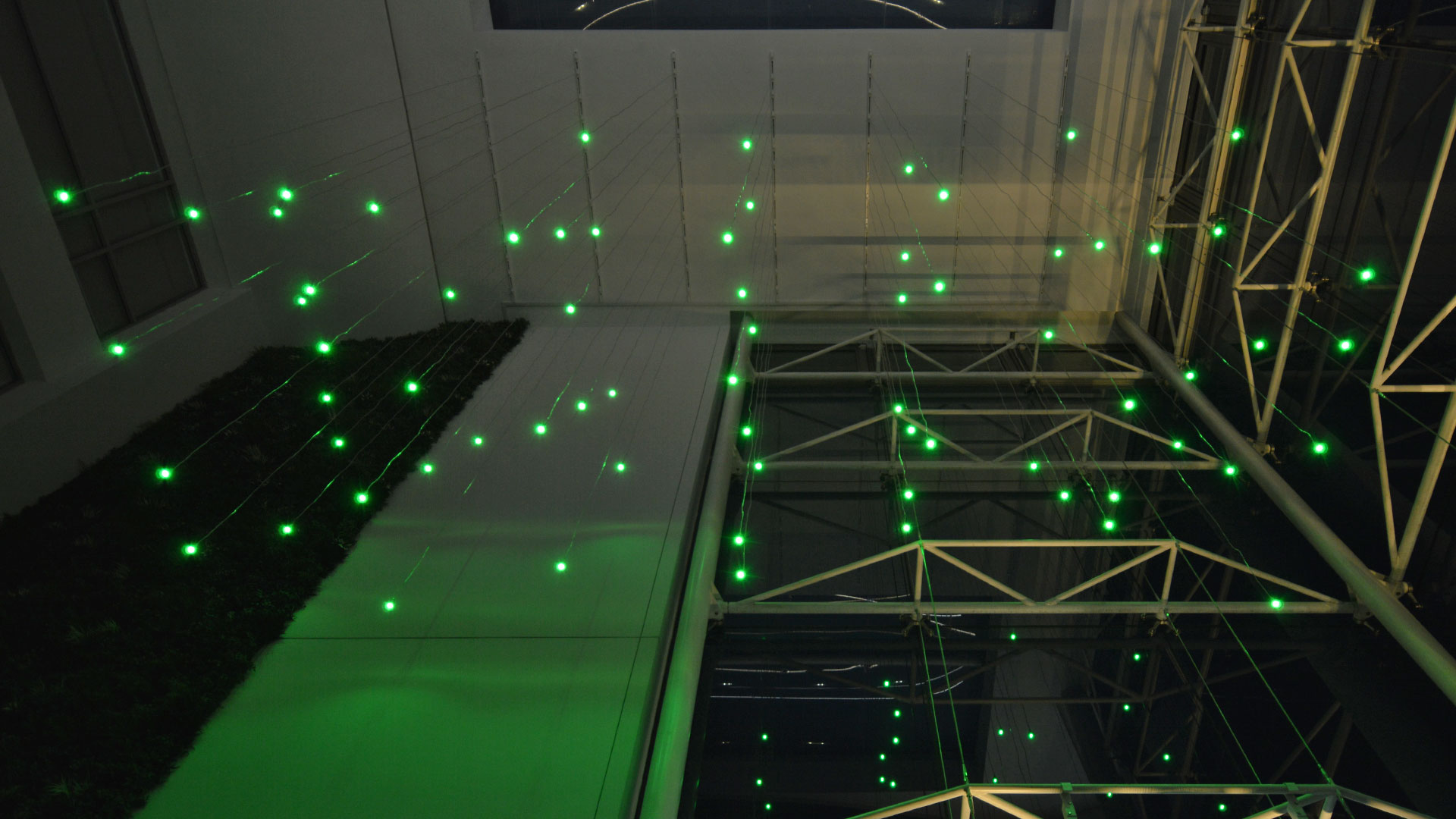 Atrium ceiling in green — repositionable globe drops on white track