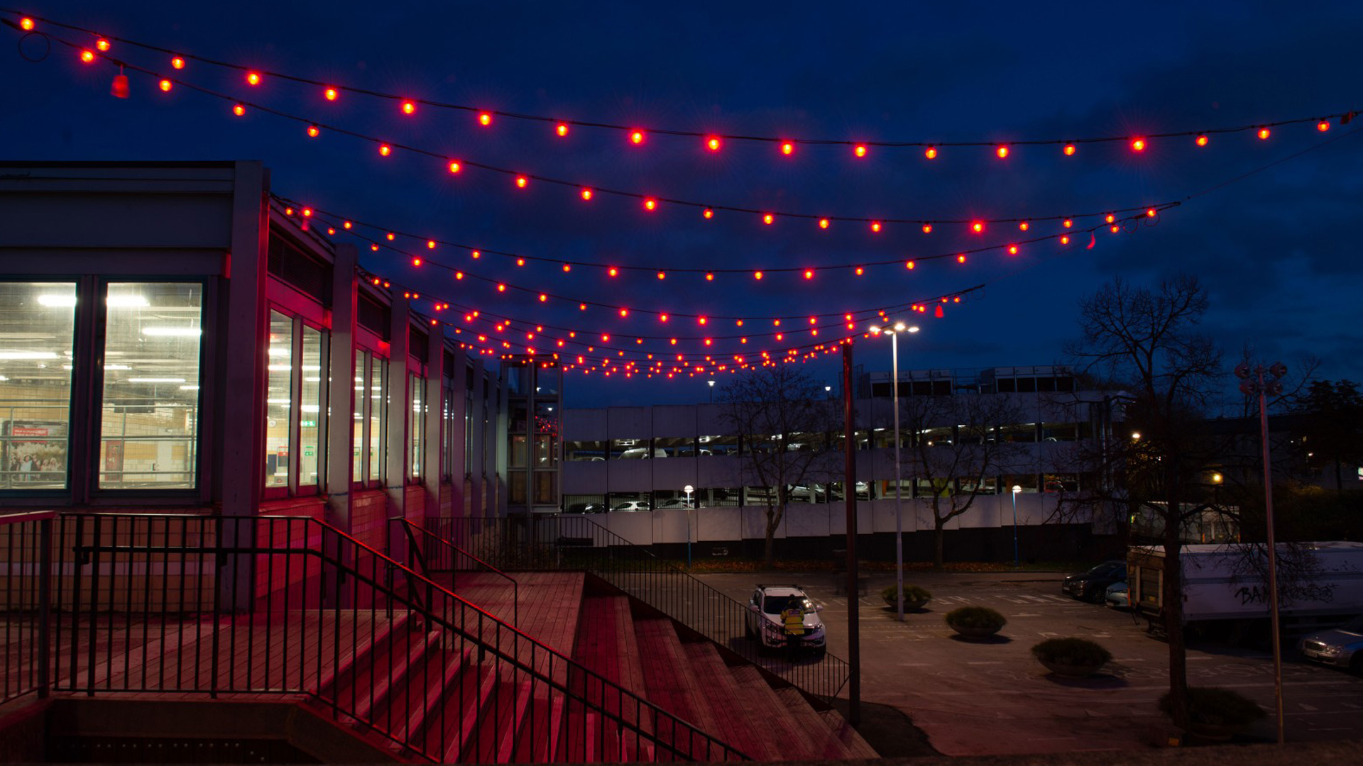 Red colour scene across the square — one of seven weekly programmes