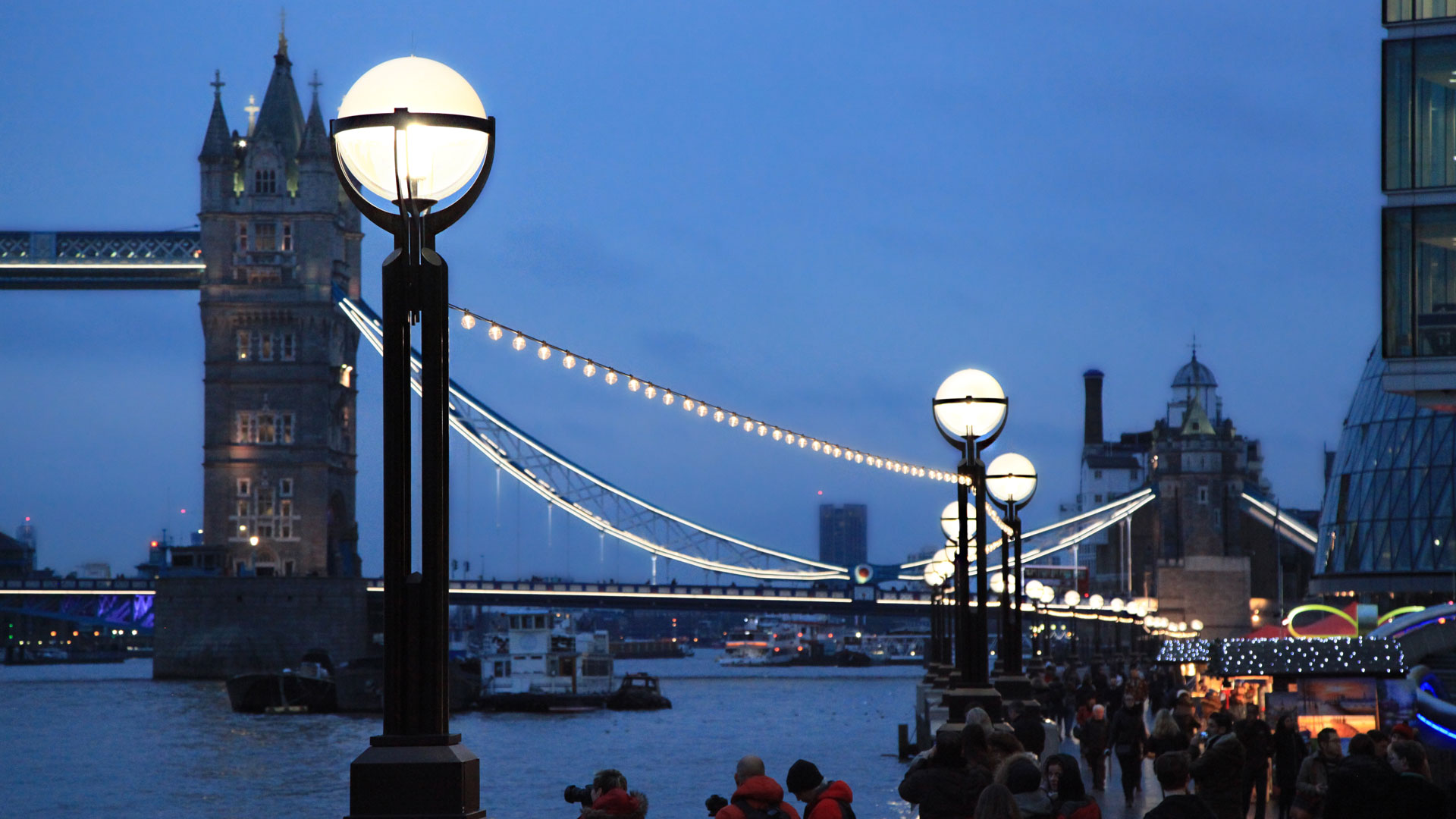 Tower Bridge at dusk beyond the Large Globe promenade run