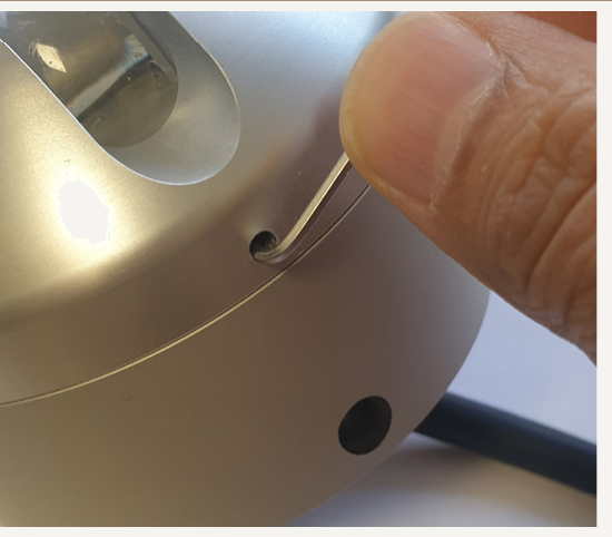 Figure 2 — Loosen glare guard screws